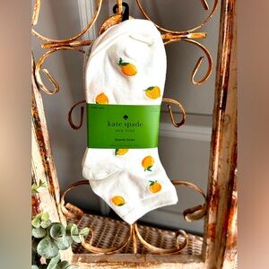 Kate Spade New York quarter socks with a lemon pattern.